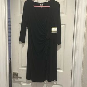 Beautiful Anne Klein black dress with wrap style front.